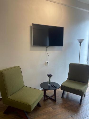 TV a/nebo společenská místnost v ubytování Granja & Vivero Lavanda