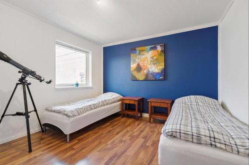 Postel nebo postele na pokoji v ubytování Summer house in a fun area