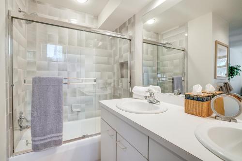 a white bathroom with a sink and a shower at Mtn-View Deck, Workspace! Walkable Frisco Condo in Frisco