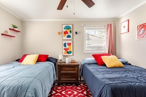a bedroom with two beds and a window at Colorful & Cozy 3 Bedroom in Columbus in Columbus