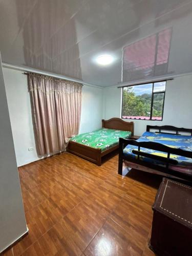 Postel nebo postele na pokoji v ubytování Hermosa finca