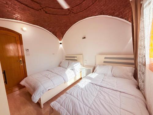 Ένα ή περισσότερα κρεβάτια σε δωμάτιο στο Upper Egypt Villa