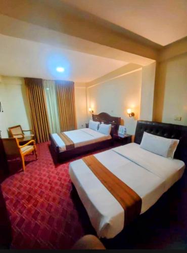 En eller flere senge i et værelse på Keba Guest House