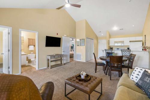 a living room with a kitchen and a dining room at Spring Creek Escape - Balcony with Views in Branson