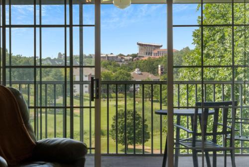 a room with a window with a table and chairs at Spring Creek Escape - Balcony with Views in Branson
