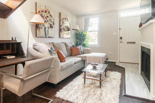 a living room with a couch and a fireplace at King Bed & Fenced Yard - Floyd's Freedom- Book Now! in Alexandria