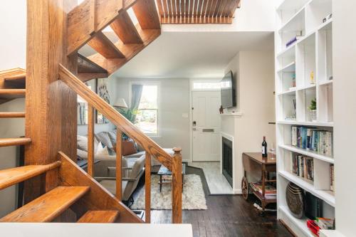 a staircase in a house with a living room at King Bed & Fenced Yard - Floyd's Freedom- Book Now! in Alexandria