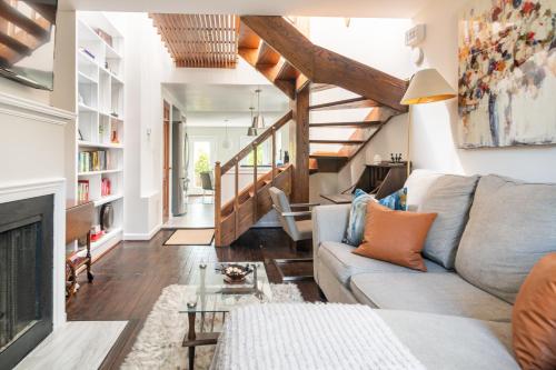 a living room with a couch and a fireplace at King Bed & Fenced Yard - Floyd's Freedom- Book Now! in Alexandria
