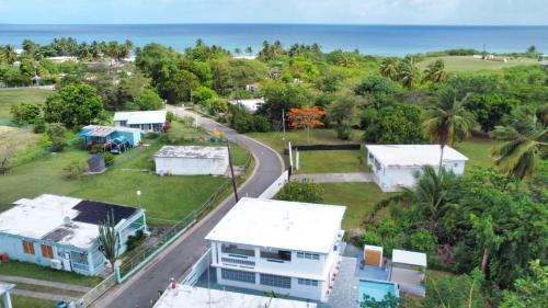 an aerial view of houses and the ocean at Casa Anastasia Beachside Villa with Pool in Vieques