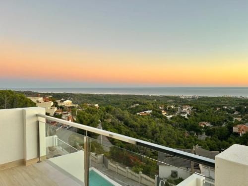 a view of the ocean from the balcony of a house at Les Flors de Cunit Villa Liria in Cunit
