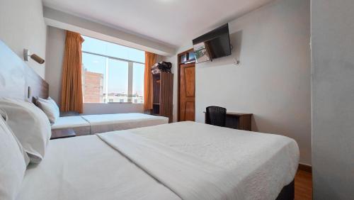 Postel nebo postele na pokoji v ubytování Huara Hs