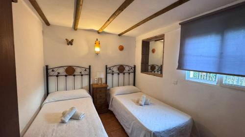 Postel nebo postele na pokoji v ubytování Villa Paloma Frigiliana