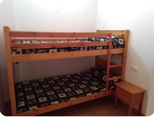 two sets of bunk beds in a room at Casa Rural Trinquete in Montán