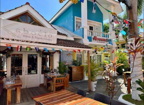 a restaurant with a table and chairs in front of a building at Apartment Luxury ONA Residence, Punta Cana in Punta Cana