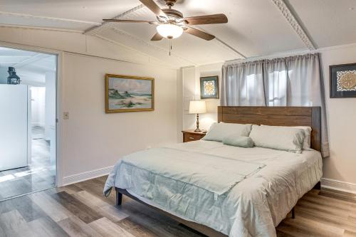 a bedroom with a bed and a ceiling fan at Bring Your Boat! Homosassa Retreat Less Than 5 Mi to River in Homosassa Springs
