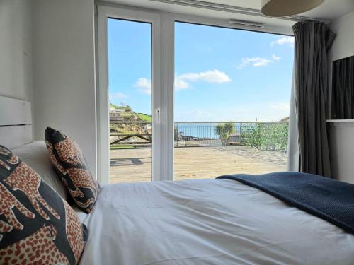 a bedroom with a bed and a view of the ocean at Millendreath Oean View Villa in Saint Martin