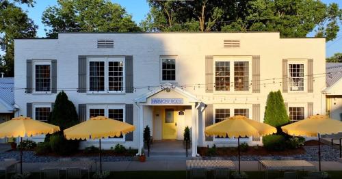 a white building with umbrellas in front of it at Harmony House in Nashville