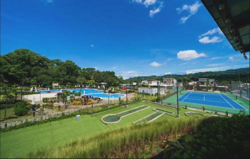 a view of a swimming pool at a park at 3-bedroom The Dream House - Herradura & Los Sueños Getaway in Herradura