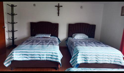 Postel nebo postele na pokoji v ubytování Hospedaje Vega del Rio