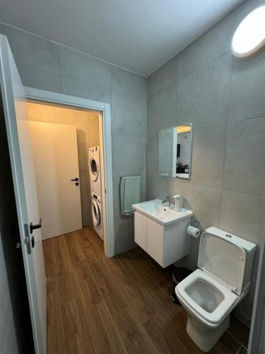 a bathroom with a toilet and a sink at Modern Studio in Central Victoria in Victoria