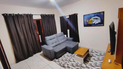 Coin salon dans l'établissement Casa de Férias do Ferreri Cabo Frio Próx Ponte Quebrada Rio São João