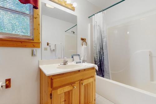 a bathroom with a sink and a shower at Hickory Hill in Pigeon Forge