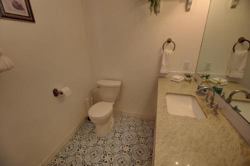 a bathroom with a toilet and a sink at The suite #2502 in Sugarloaf