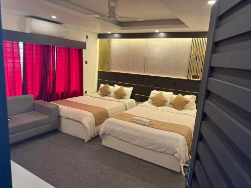 Postel nebo postele na pokoji v ubytování The Grand Mafi Hotel & Spa