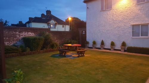 a picnic table in the yard of a house at Balkan Lodge Oxford in Oxford