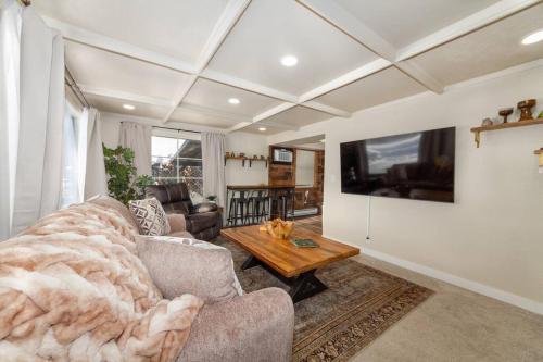 a living room with a couch and a table at Adorable 2 BD 1 BTH Home Minutes Away from Gonzaga in Spokane