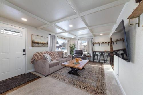a living room with a couch and a table at Adorable 2 BD 1 BTH Home Minutes Away from Gonzaga in Spokane
