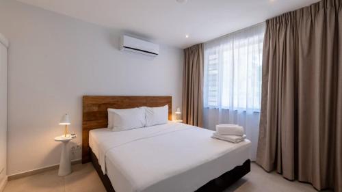 Llit o llits en una habitació de The Breeze Escape