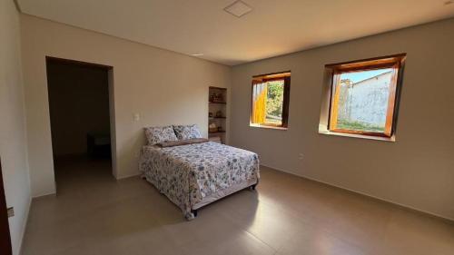 En eller flere senge i et værelse på Casa Rosada em Rio de Contas