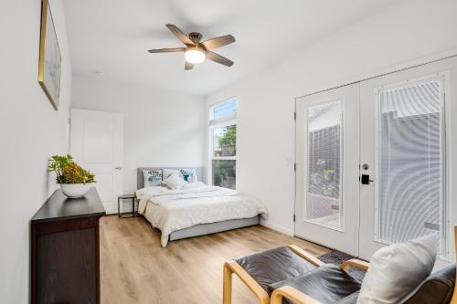 a bedroom with a bed and a ceiling fan at Privately Secluded Guesthouse in Fremont