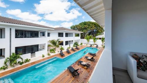 an image of a villa with a swimming pool at The Wave - Excellently located Penthouse with pool in Jan Thiel