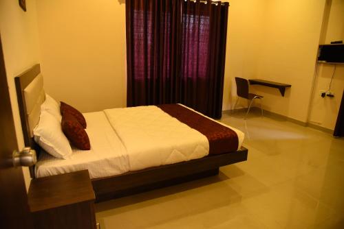 Postel nebo postele na pokoji v ubytování Daffodil serviced apartments