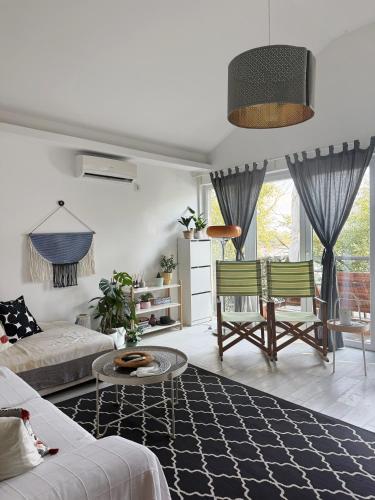 a living room with a couch and a table at River house Grana in Belgrade