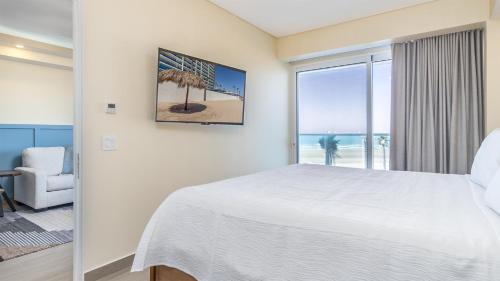 Voodi või voodid majutusasutuse Splash in The New Lazy River/Stay in Modern Luxury Encantame Viento 303 toas