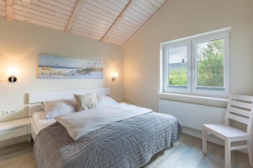 Ένα ή περισσότερα κρεβάτια σε δωμάτιο στο Bai E Dik 20