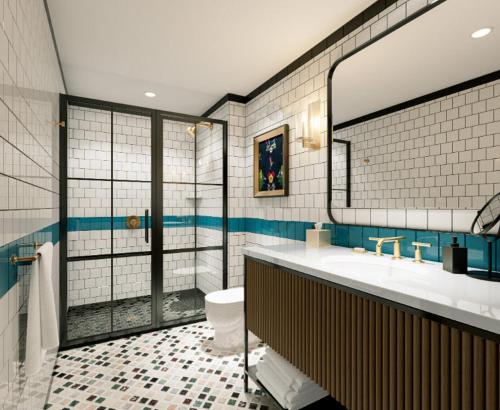 a bathroom with a sink and a toilet and a mirror at The Union Hotel, Flemington, a Tribute Portfolio Hotel in Flemington