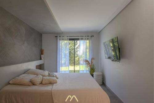 Ένα ή περισσότερα κρεβάτια σε δωμάτιο στο Le Cocoon