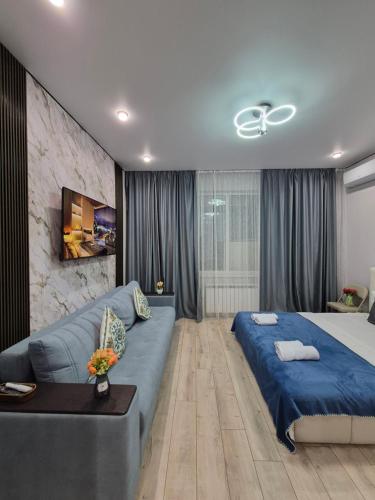 Postel nebo postele na pokoji v ubytování Сердце города & City Center