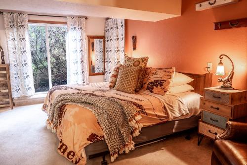 a bedroom with a bed and a window at Hot Tub & Game Room in Large Ocean Front Home! Second Story in Holiday Beach