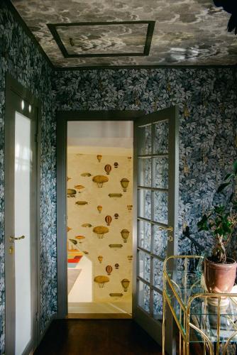 a room with a wall with fish on it at Revolverhotel in Visby