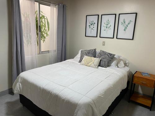 Ένα ή περισσότερα κρεβάτια σε δωμάτιο στο Casa Flory-El jardin secreto-