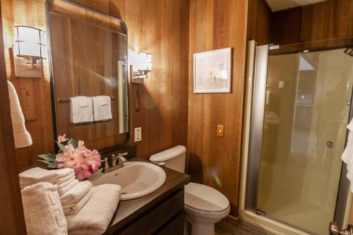 a bathroom with a sink and a toilet and a shower at Ocean Front on Miles of Sandy Beach! Boho Shores in San Marine