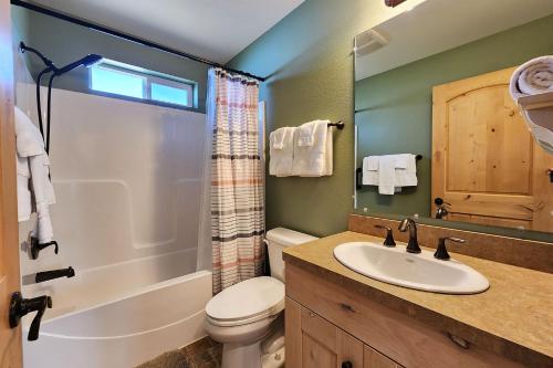 a bathroom with a toilet sink and a shower at Ocean View, Walk to Everything! Dog Friendly! Wheelhouse Cottage in Yachats