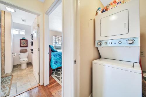 a laundry room with a washer and dryer at Escape Bay Views Large Deck Group Ready in Port Bolivar