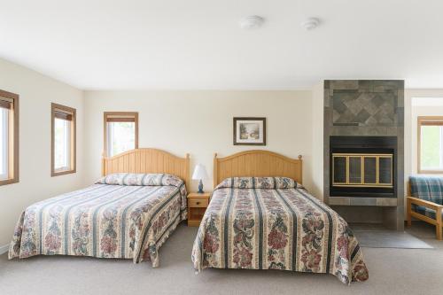 Postel nebo postele na pokoji v ubytování Sunny Point Resort