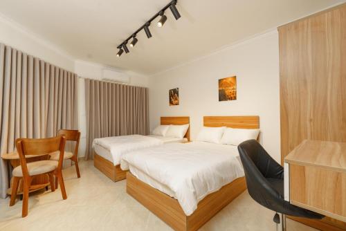 Giường trong phòng chung tại Rock Pyramids Hotel